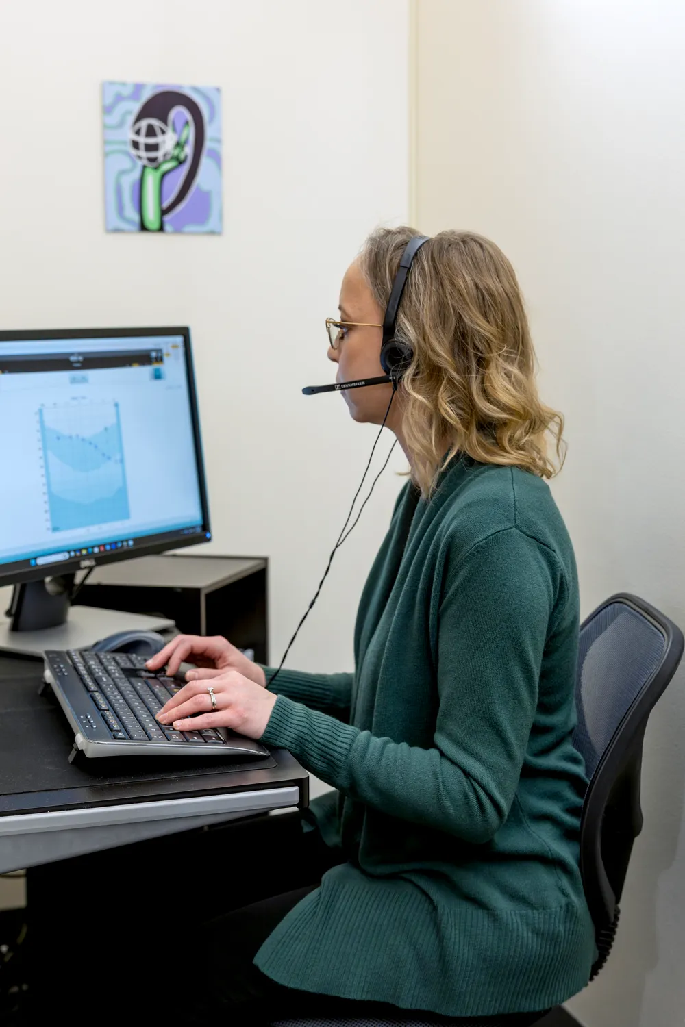 Patient completing a hearing assessment at New Leaf Hearing Care